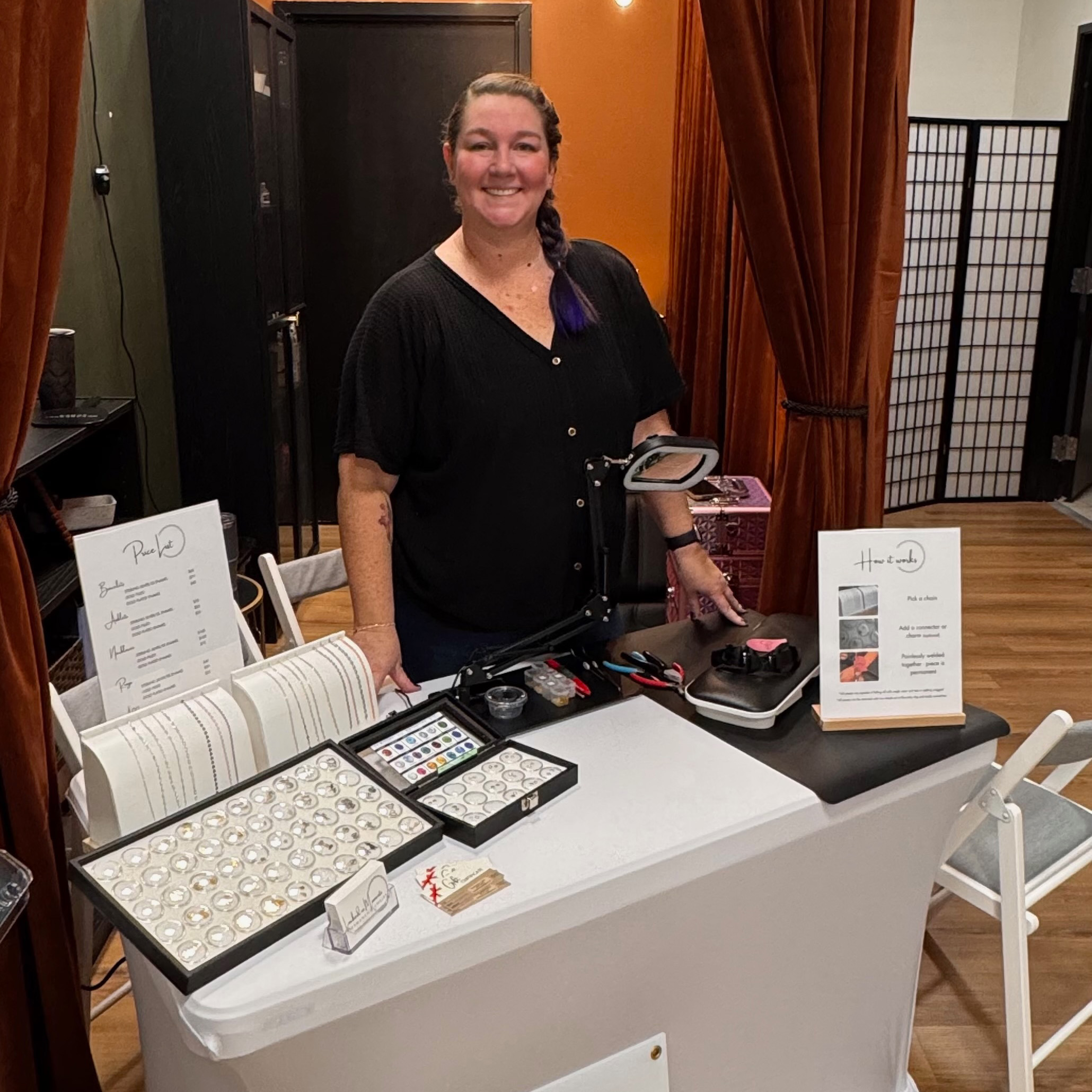 Seneca at her booth at a boutique